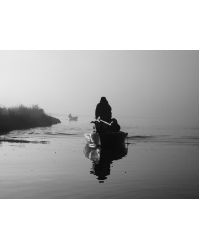 Hunters in a boat by Luca Santini | Photomakers